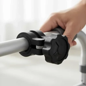 Close-up of the adjustable clamp mechanism for a walker cup holder, showing how it securely fits different frame sizes.